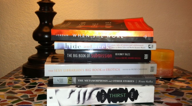 The books Jade is currently reading, stacked on her nightstand.