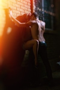 Man kissing woman against a wall. Artem Merzlenko ©123RF.com